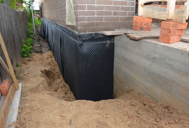 Happy homeowners after waterproofing job in Grand Rapids